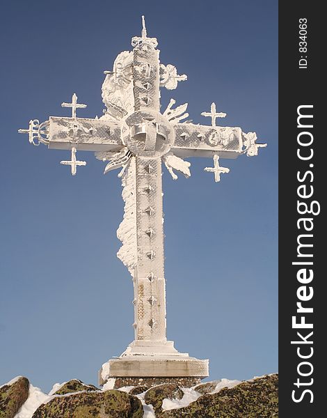 Orthodox cross at top of mountain, mounting skiing resort Sheregesh.