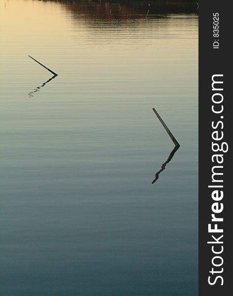 Pair of Winter Mooring Sticks in Twilight, Quissett, Cape Cod, Massachusetts