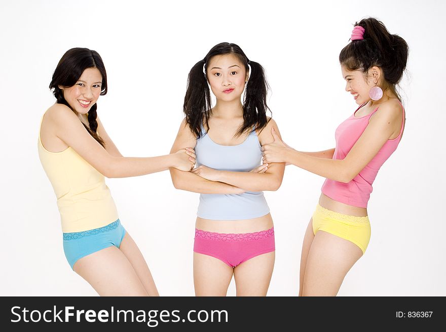 Two pretty asian women fighting over a friend. Two pretty asian women fighting over a friend
