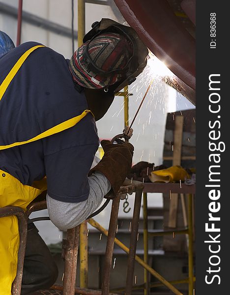 Back view of welder working. Back view of welder working