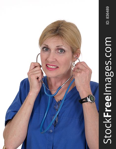 Headshot photo of beautiful nurse or doctor putting on stethoscope. Headshot photo of beautiful nurse or doctor putting on stethoscope