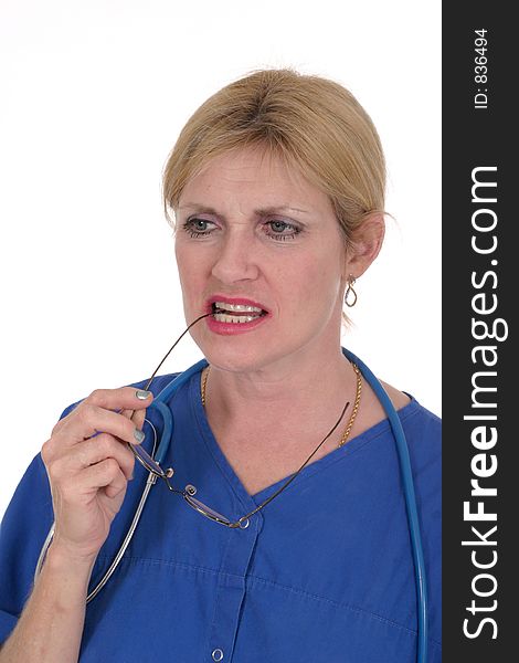 Photo of nurse or doctor with stethoscope and glasses in mouth thinking, in thought. Photo of nurse or doctor with stethoscope and glasses in mouth thinking, in thought