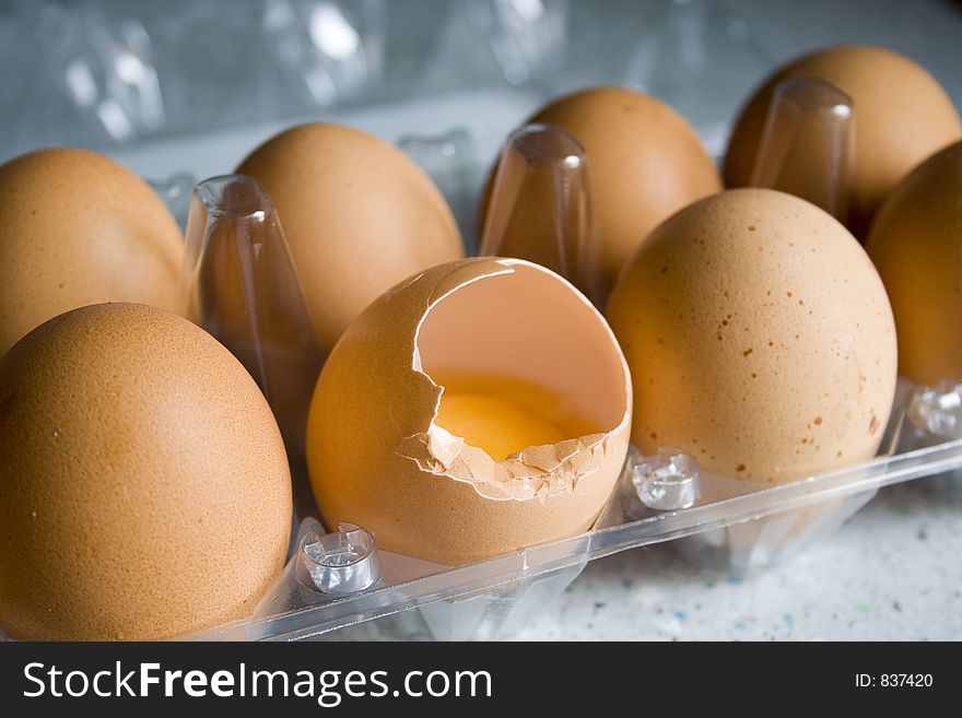 Cracked egg in the box of egg. Cracked egg in the box of egg