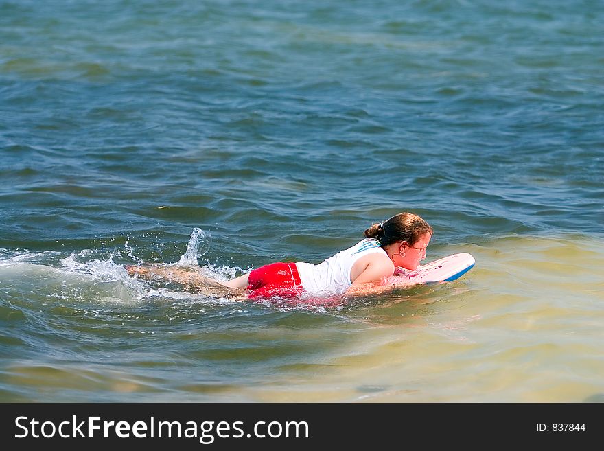 Girl on body boarding swimming. Girl on body boarding swimming