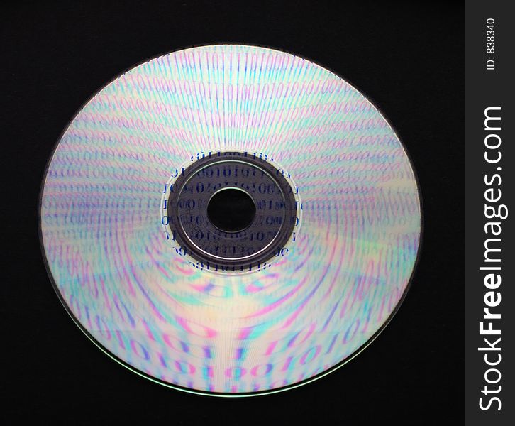 A CD on black background reflecting ones and zeros. Contain embedded clipping path. A CD on black background reflecting ones and zeros. Contain embedded clipping path.