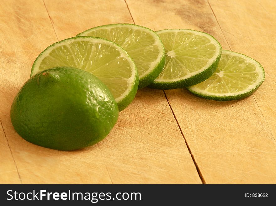 Fresh Lime on a wooden cutting board.