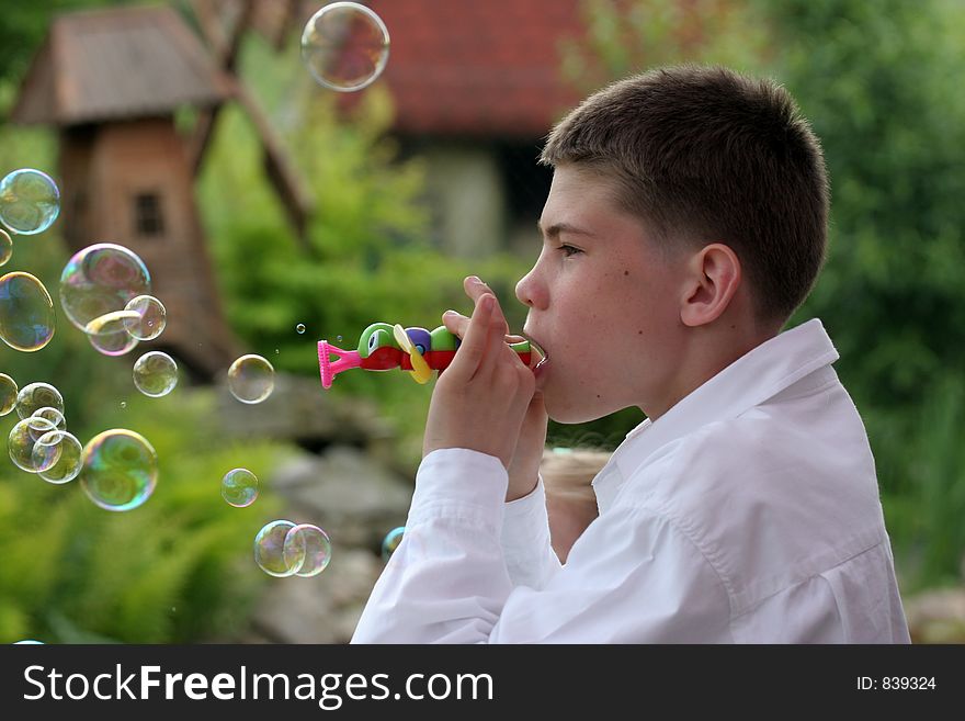 Boy blow soap-bubble