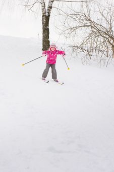 Little Girl Sliding Down Hill On Ski Royalty Free Stock Photo