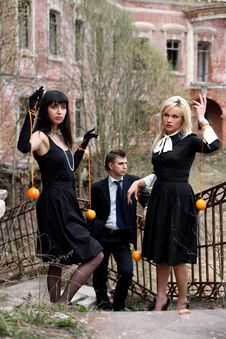 Jealousy - Girls With Oranges And Man Stock Image