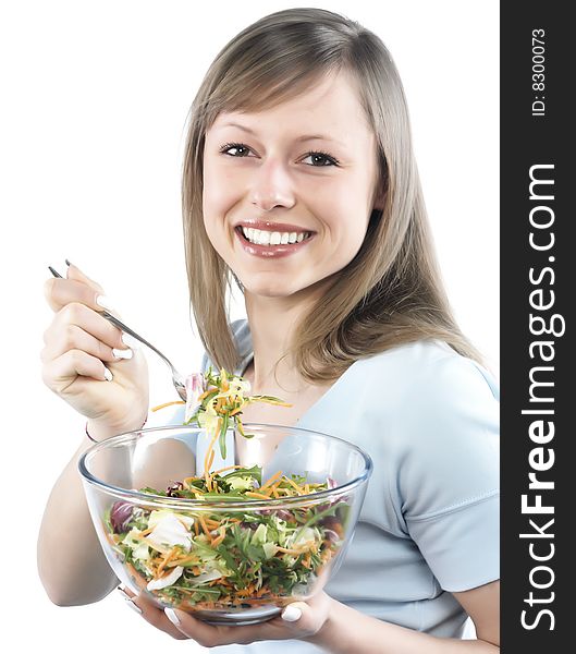 Portrait of young happy woman eating salad