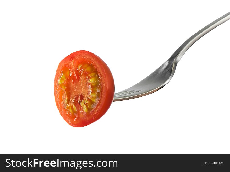 Healthy looking tomato on a fork. Isolated on white. eat healthy and fresh!. Healthy looking tomato on a fork. Isolated on white. eat healthy and fresh!