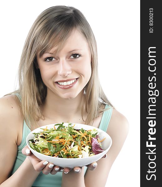 Portrait of young happy woman eating salad