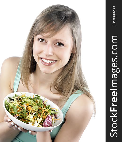 Portrait of young happy woman eating salad