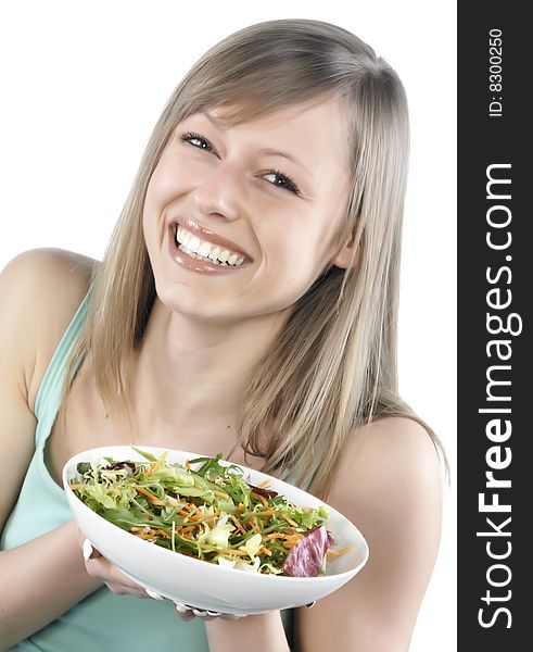 Portrait of young happy woman eating salad