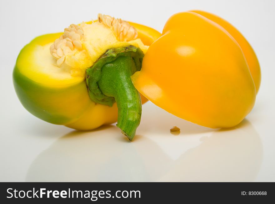 The Bulgarian pepper close up on white surface. The Bulgarian pepper close up on white surface