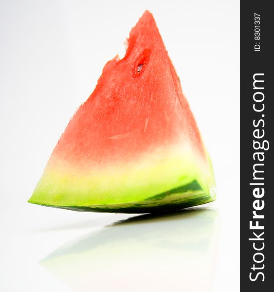Juicy watermelon on a white surface