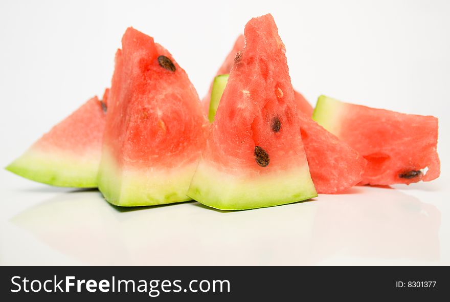 Juicy watermelon on a white surface. Juicy watermelon on a white surface