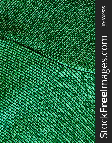 Green fabric with embroidery and decorations. Green fabric with embroidery and decorations