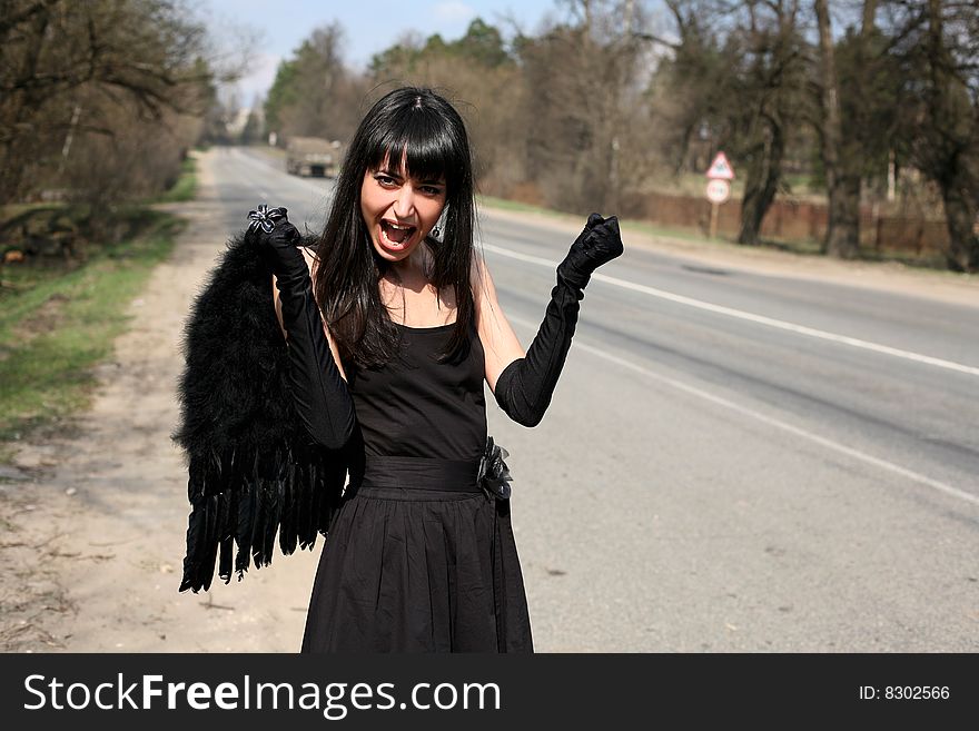 Black angel at the road. Black angel at the road