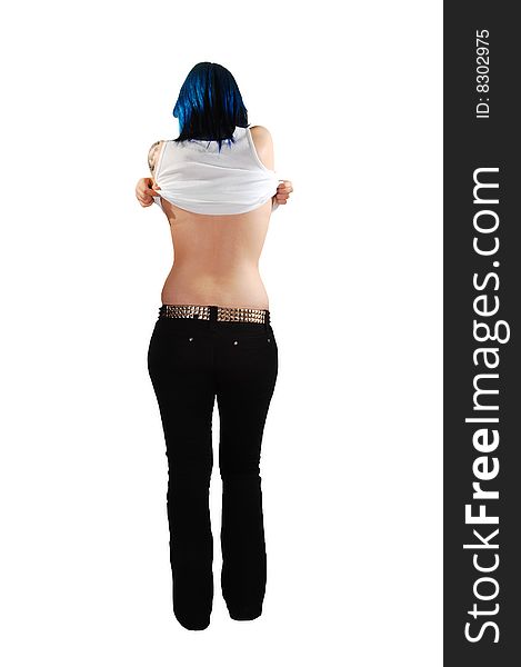 The blue haired woman in black jeans taking off her shirt and shooing her nice back, on white background. The blue haired woman in black jeans taking off her shirt and shooing her nice back, on white background.