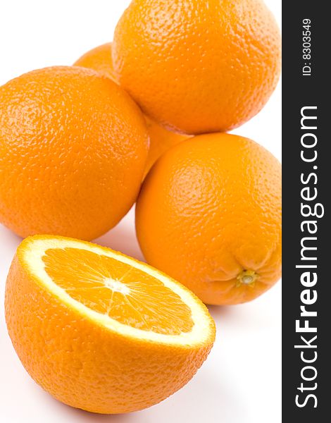 Fresh oranges closeup on white background
