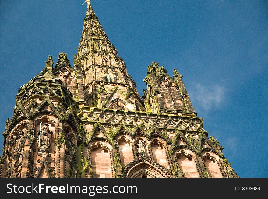 The spire of lichfield cathedral and its carvings. The spire of lichfield cathedral and its carvings