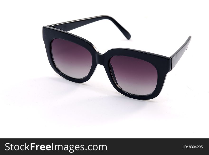 Pink sunglasses on white background