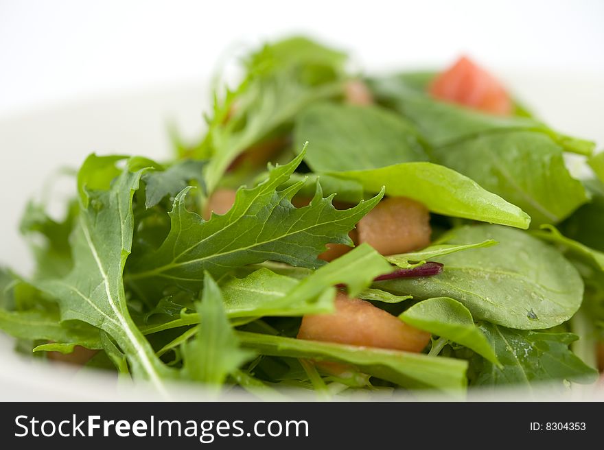 Baby leaf salad with cube cut tomato. Baby leaf salad with cube cut tomato