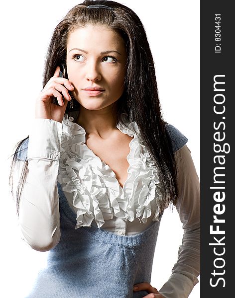 Young brunette woman talking on the cell-phone. Young brunette woman talking on the cell-phone
