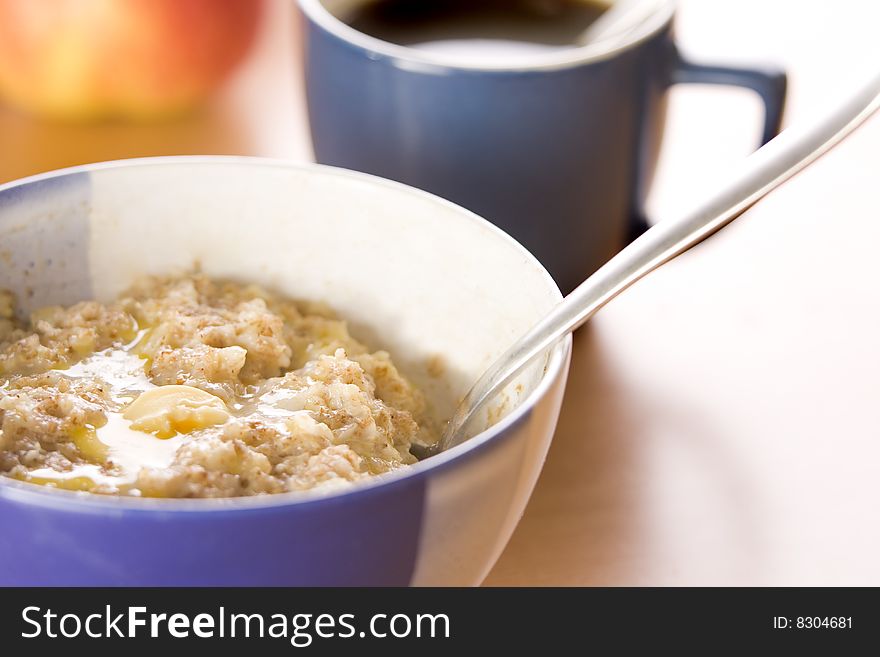 Hot morning porridge with spoon