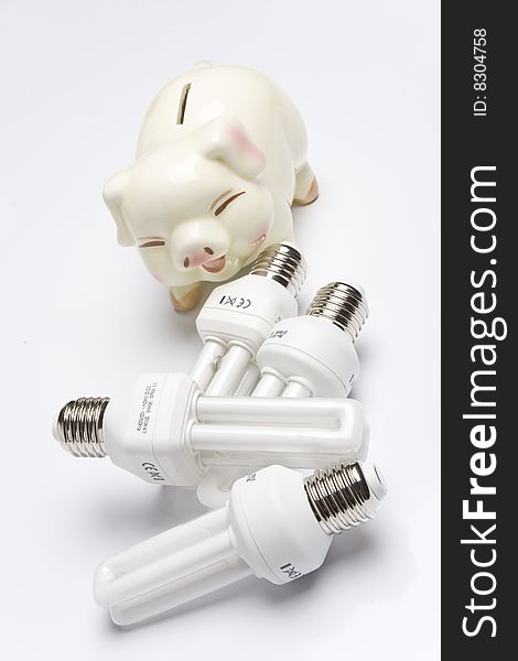 Piggy bank with fluorescent light bulb (smart energy).