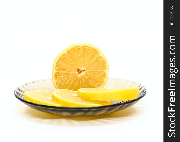 Lemon slices on plate isolated on white