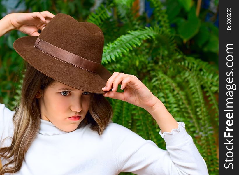 Angry teen girl in hat