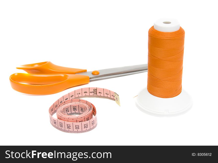 Tape measure and shears on white background