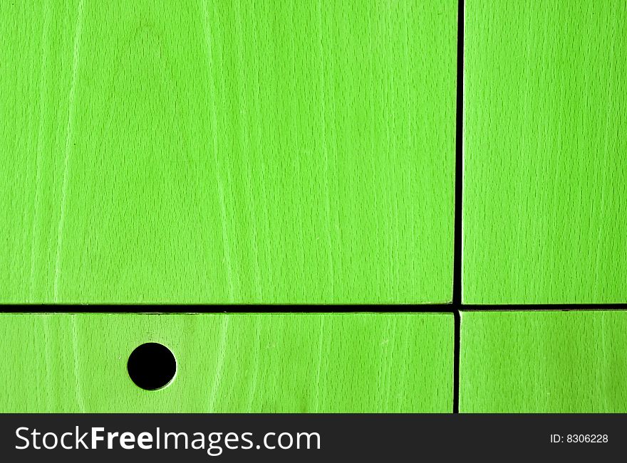 Colored wooden panel with holes