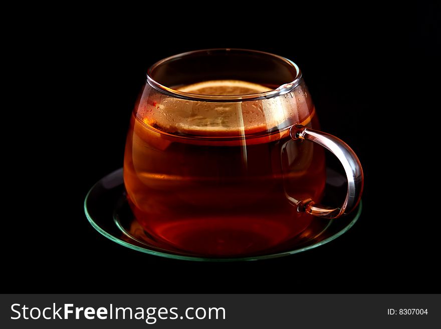 Cup of tea black background