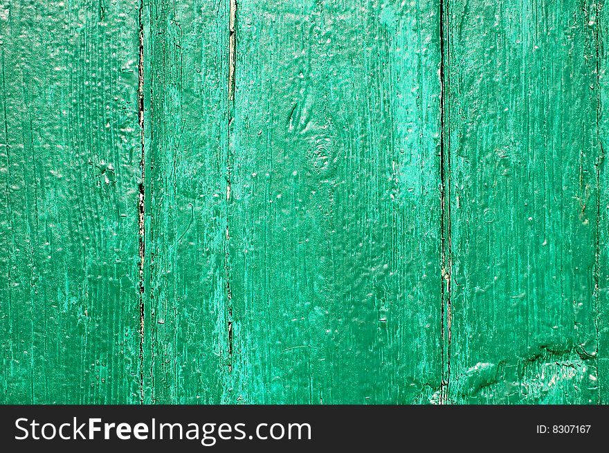 Green painted cracked wooden plank. Green painted cracked wooden plank