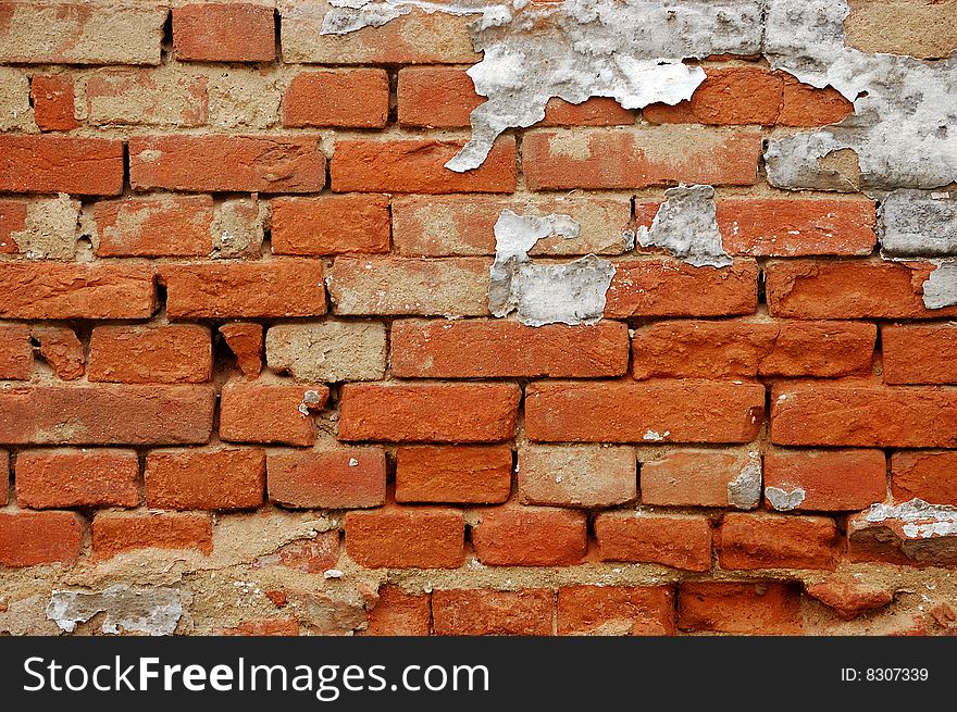 Fragment of tumbledown red brick wall. Fragment of tumbledown red brick wall