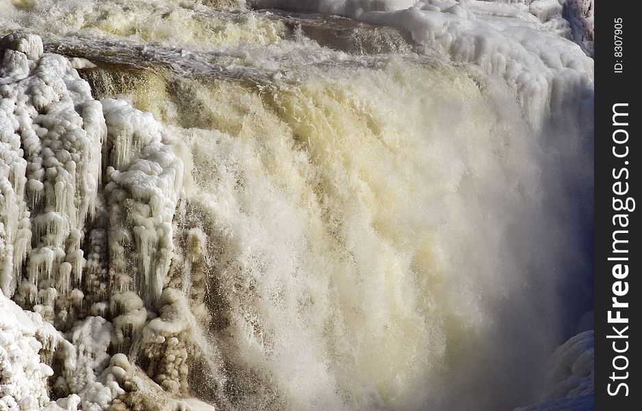 Partly frozen waterfall in Ausable Chasm, upstate New York. Partly frozen waterfall in Ausable Chasm, upstate New York.