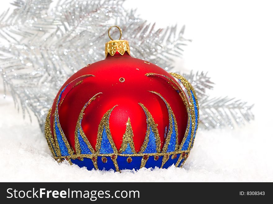 Red Christmas ball and winter tree