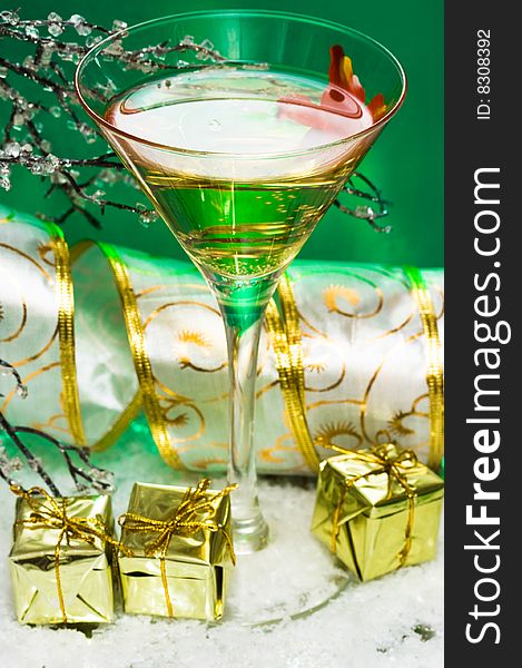 Glass with champagne and gift boxes