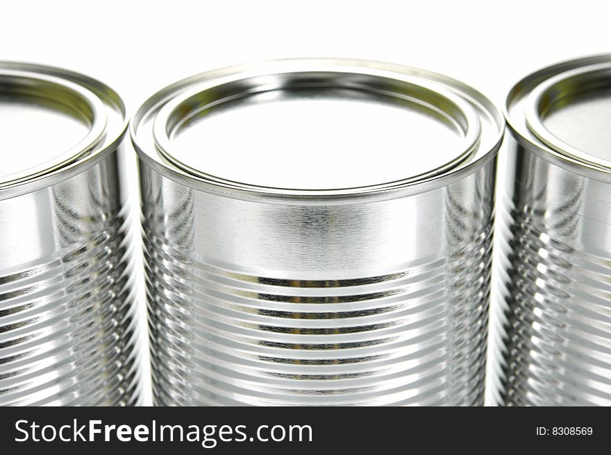 Tin canisters isolated against a white background
