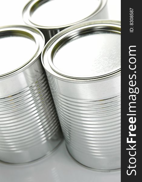 Tin canisters isolated against a white background