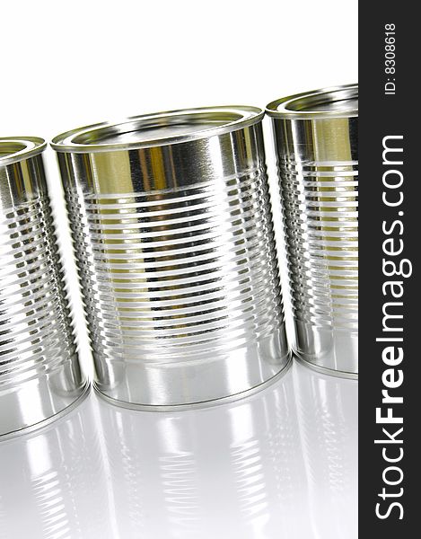 Tin canisters isolated against a white background