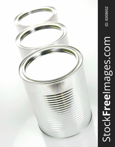 Tin canisters isolated against a white background