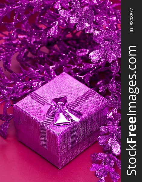 Pink gift box with decoration leaves