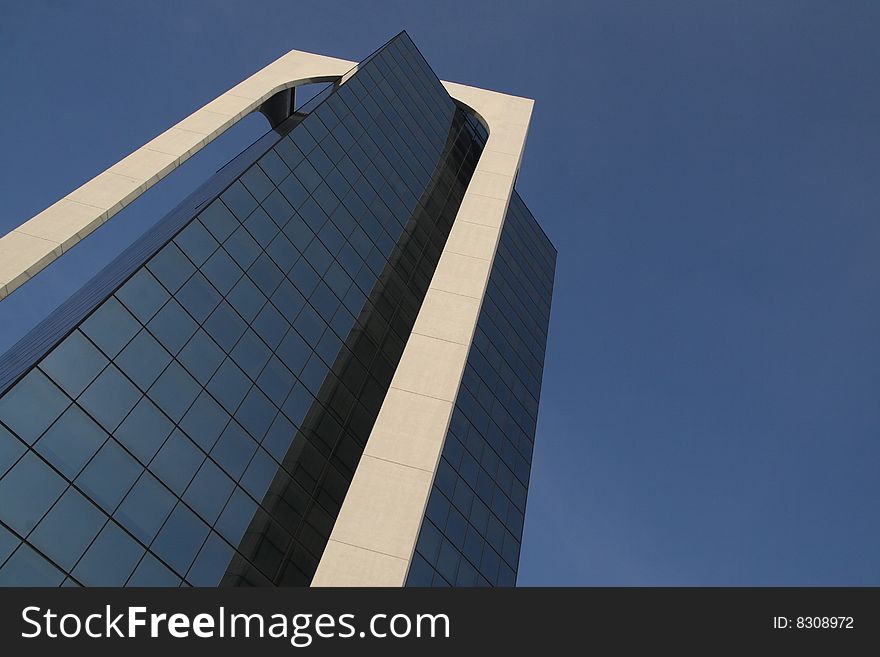 A modern building made of glass in Sesto San Giovanni, Italy. A modern building made of glass in Sesto San Giovanni, Italy