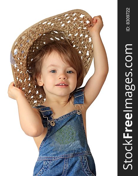 A little girl is in a straw hat. A little girl is in a straw hat.