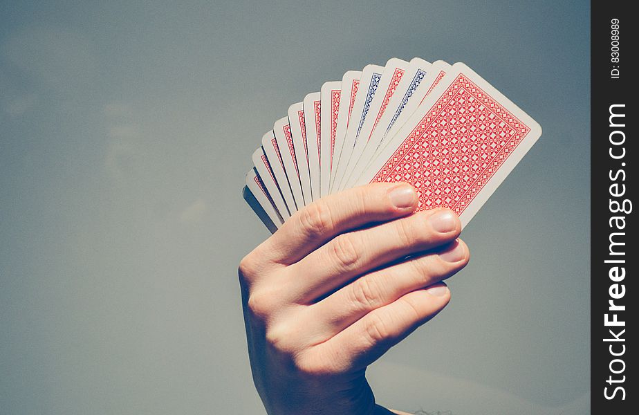 Hand Holding Playing Cards