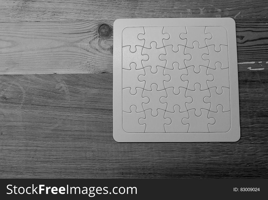 Gray Scale Photo of Jigsaw Puzzle